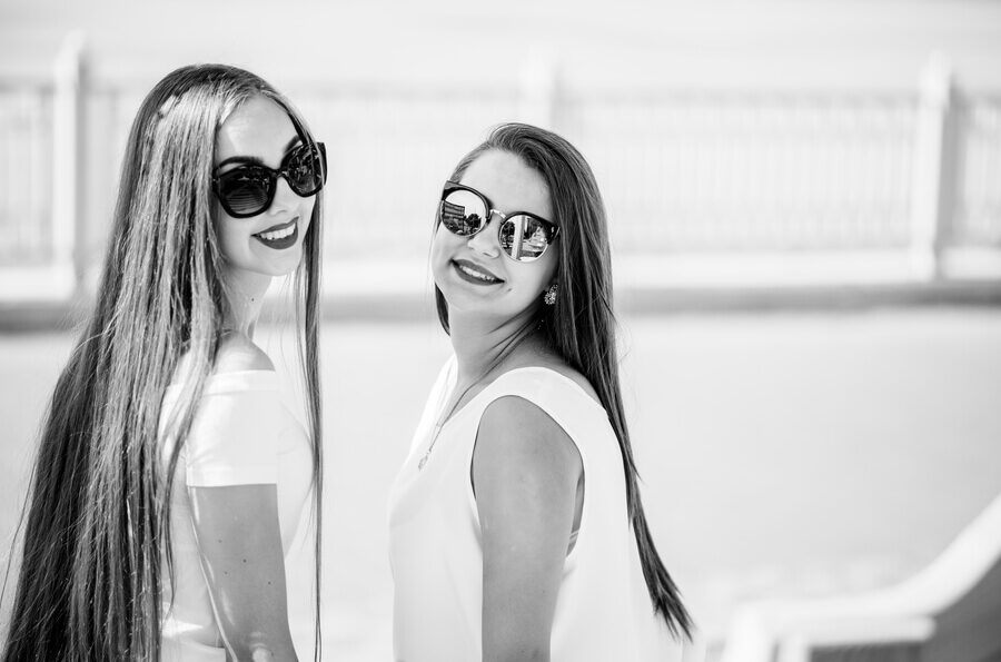 two-beautiful-girls-wearing-sunglasses-pose-with-a-2025-02-11-01-30-13-utc (1) (1)