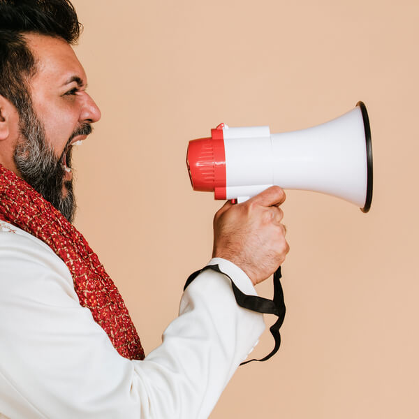 indian-man-screaming-into-a-megaphone-2025-02-10-09-23-48-utc (1) (1)